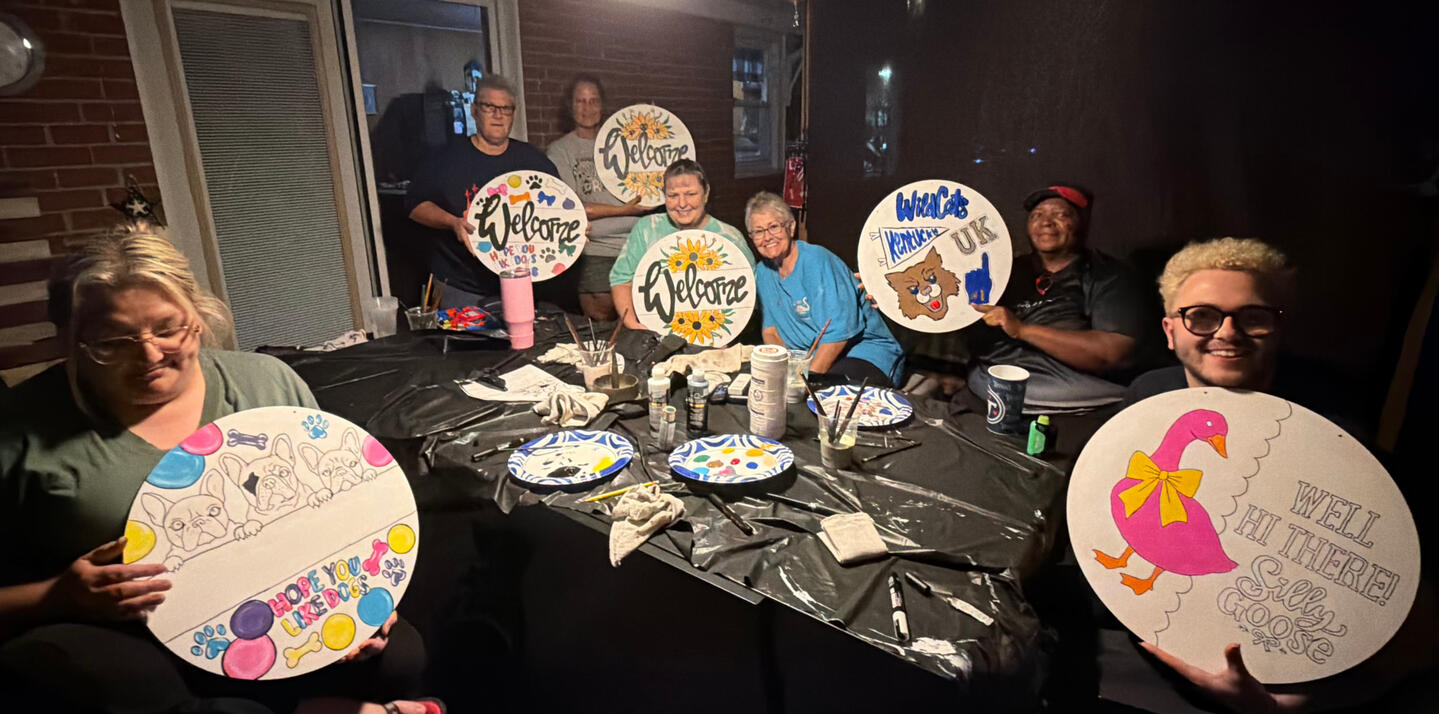 Private Paint Party in Central City KY | Art & Aperture Friends enjoying a private Art & Aperture paint party in Central City, Kentucky, creating personalized painted signs together for a fun group celebration.