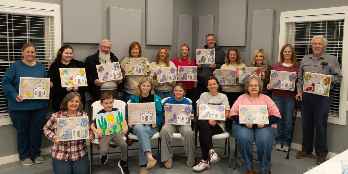Church Paint Party in Greenville, KY | Art & Aperture Church group members of all ages showing their finished canvas paintings after an Art & Aperture paint party in Greenville, Kentucky.